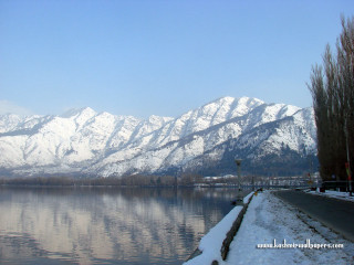 Mountain range reflection lake snow 5 - a street light in the foreground free wallpaper