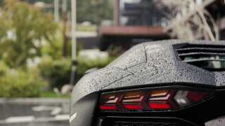 Black sports car rainy day - its hood free wallpaper