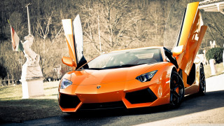 Orange sports car parked street 4 - nice looking orange sports car free wallpaper