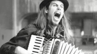 Long haired man hat accordion - open free wallpaper