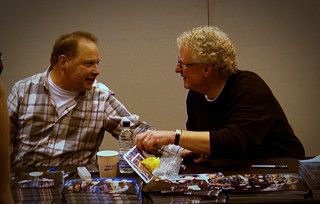 Two men sitting table food - food free wallpaper