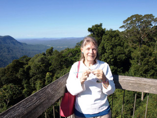 Woman wooden balcony mountains trees - a string free wallpaper for desktop