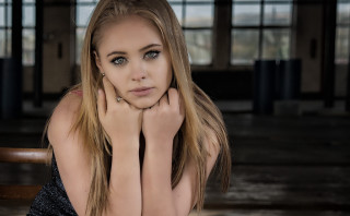 Woman sitting chair hands face 2 - her chin free wallpaper