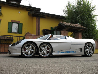 White sports car yellow house - a yellow building free wallpaper