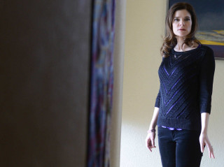 Woman standing room painting wall - the wall behind her free wallpaper