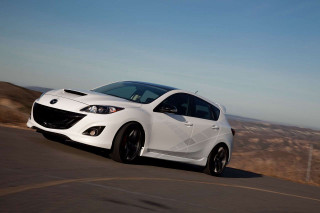 White car driving hill fenced - a hill in the background free wallpaper