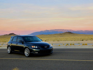 Black car mountain range sunset - a black car free wallpaper