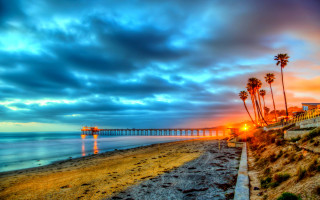 Beach pier palm trees sunset 3 - a pier in the distance free wallpaper