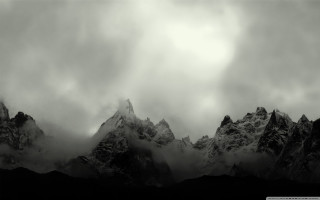 Black white mountain range clouds - a dark sky above free wallpaper