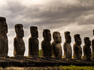 Moai statues field cloudy sky - under free wallpaper