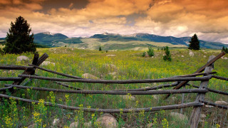 Wooden fence field mountains clouds - in a field free wallpaper