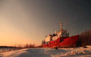 Large red boat snow field - top of a snow free wallpaper