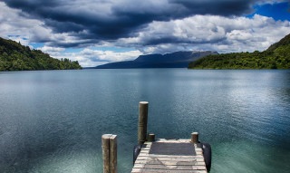 Dock lake mountains clouds water - a dock free wallpaper for desktop