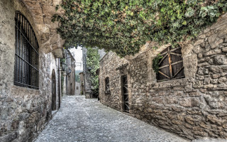 Narrow alley stone building tree - romanesque free wallpaper