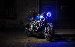 Blue motorcycle dark room wheelie - anson maddock free wallpaper