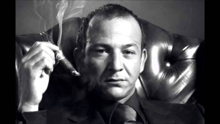 Man suit smoking cigarette holding 2 - chafik charobim free wallpaper