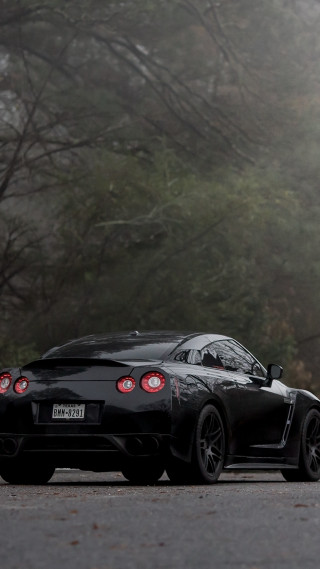 Black sports car foggy road - free motorcycles wallpaper for mobile