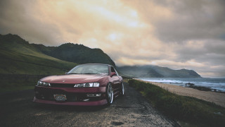 Red car parked ocean mountains 2 - fine art free wallpaper