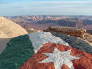 Flag painted rock desert mountains - a rock in the desert free wallpaper