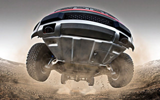 Large truck jumping dirt road - a large truck free wallpaper