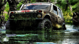 Truck driving muddy river trees - muddy free wallpaper