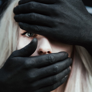 Woman black gloves covering face - free aesthetic wallpaper for tablet