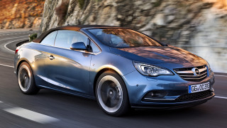 Blue opel car driving cliff - hillside free wallpaper
