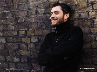 Man leaning brick wall arms - david annand free wallpaper for desktop