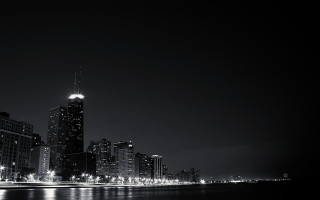 City skyline night water clock - a large body of water in front free wallpaper