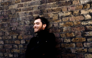 Man standing brick wall arms 2 - bradley walker tomlin free wallpaper