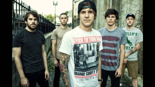 Men standing fence building graffiti - a fence and a building free wallpaper