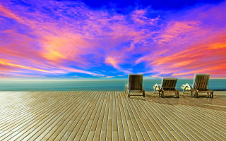 Ocean deck chairs bridge sunset - two chair free wallpaper