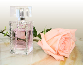 Pink rose perfume bottle table - feminine free wallpaper