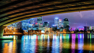 City skyline reflection water bridge - a colorful light free wallpaper