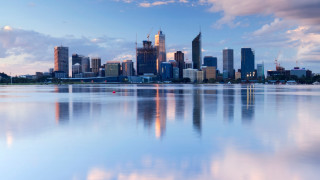 City skyline reflection lake boat - a boat in the foreground free wallpaper