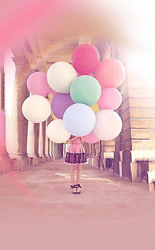 Woman holding balloons hallway columns - free happy birthday wallpaper for mobile