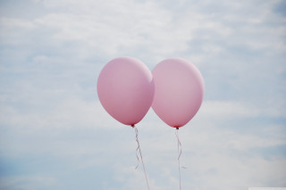 Pink balloons floating sky background - a pastel free wallpaper