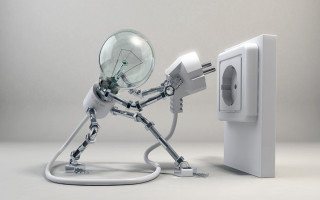 Robot holding light bulb plugged - a robot holding free wallpaper