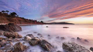 Rocky beach sunset pink sky 3 - dave allsop free wallpaper
