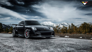 Black car parked road mountains - a black car free wallpaper