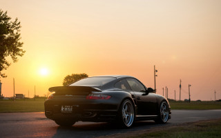 Black sports car sunset road 6 - the sun setting behind free wallpaper