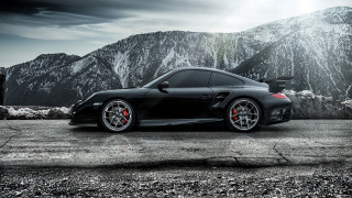 Black sports car mountain range - a black sports car free wallpaper