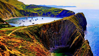 Cliff water boat scenery nature - a large cliff free wallpaper