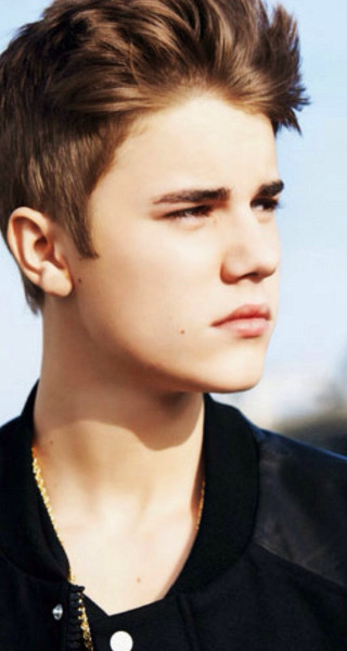 Young man spiked mohawk serious - photorealistic free wallpaper for mobile