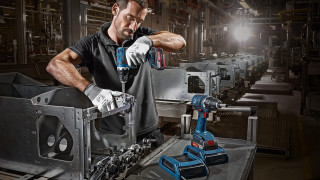 Man working machine factory spotlight - doug ohlson free wallpaper