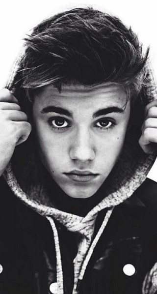 Young man hoodie serious face - a young man free wallpaper for mobile