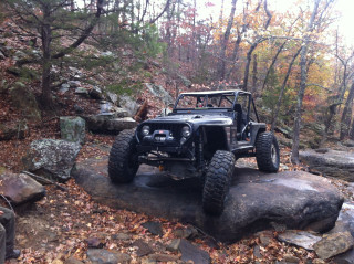 Jeep parked rock woods trees - a jeep free wallpaper