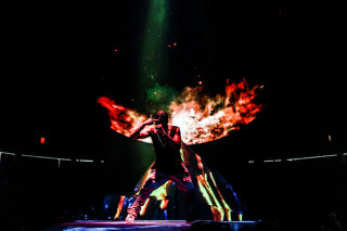 Man stage microphone fireball background - a stage free wallpaper