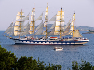 Large boat sailing water shoreline - a large boat free wallpaper