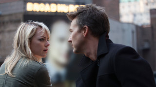 Man woman standing building sign - stuckism free wallpaper